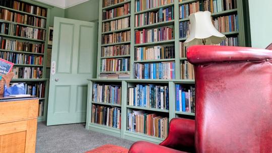 Bespoke painted home library with fitted bookcases handcrafted for a Victorian property in coastal Devon