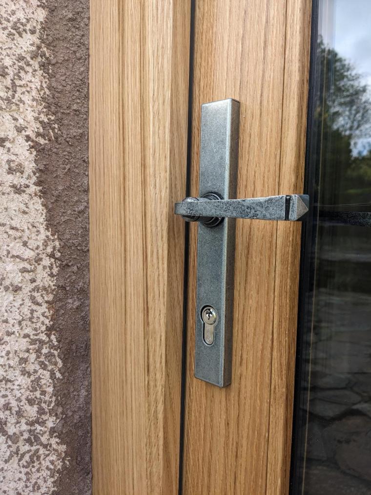 Air-dried oak external door with traditional oiled finish installed in a listed building
