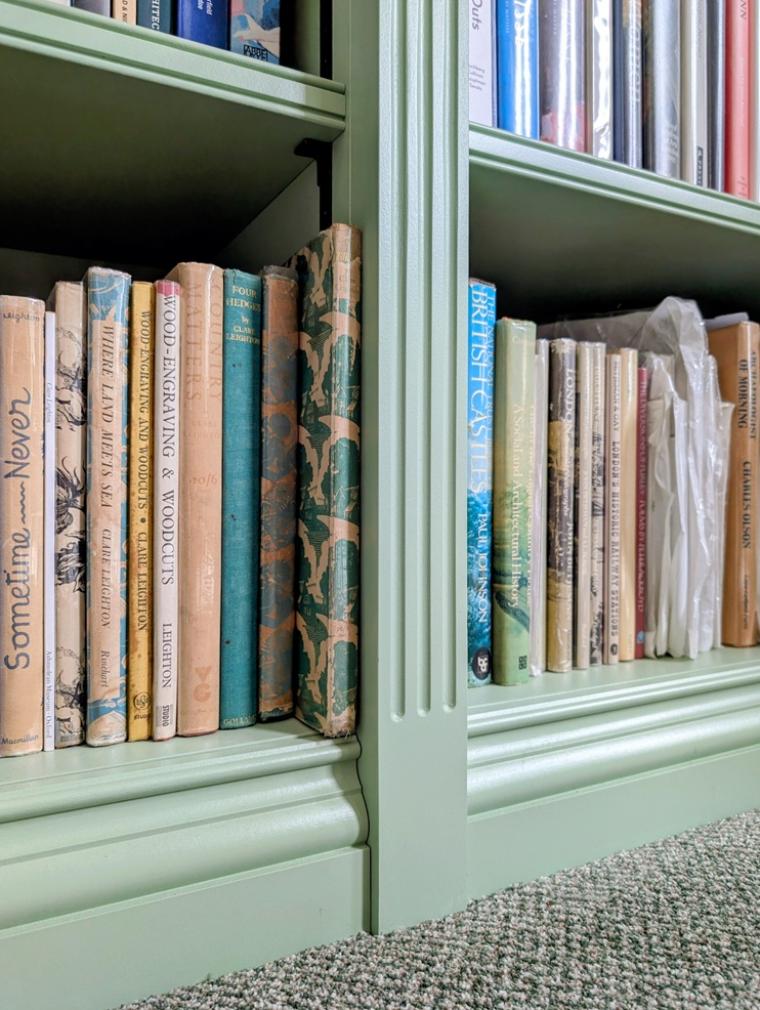 Close-up of the traditional double scratch bead detail on a handcrafted painted bookshelf.